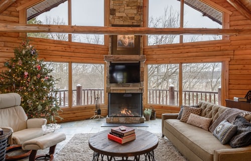 Three Sided Gas Fireplace in Log Home Living Room
